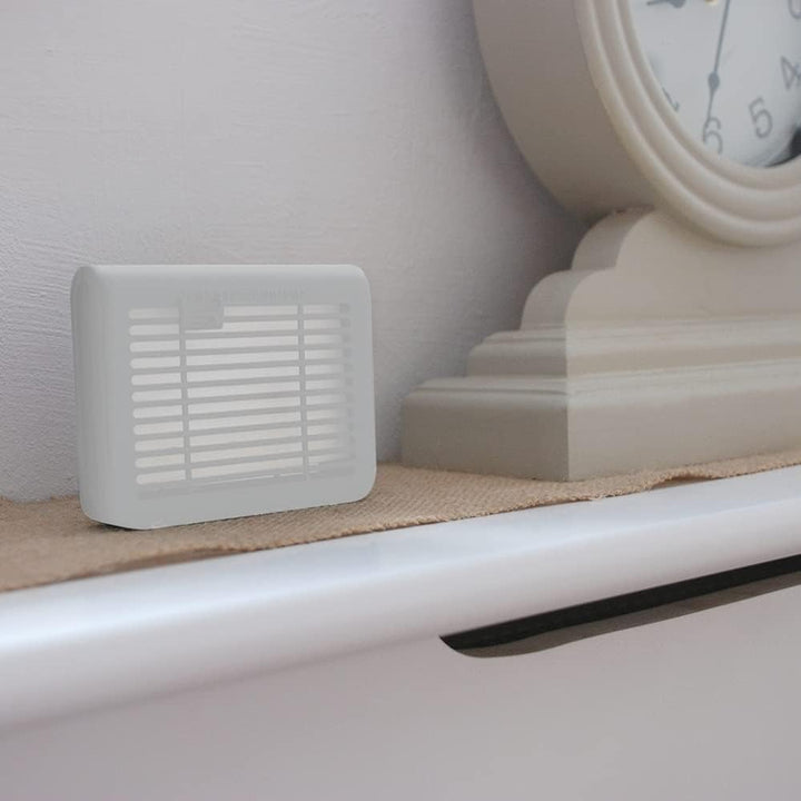 knockdown fly killer on windowsill
