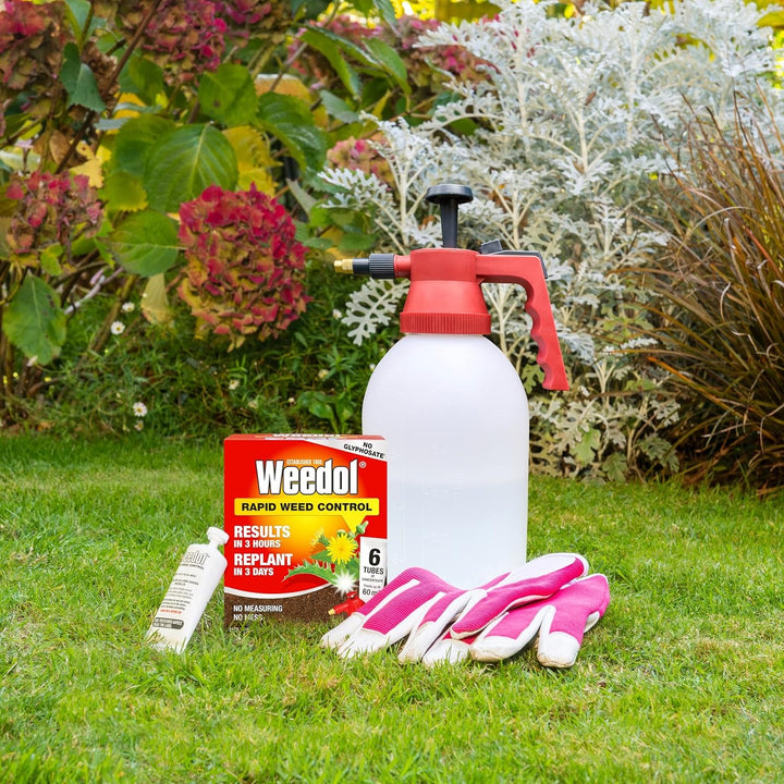 Weedol Rapid Weed Control 6 Tube pack placed on a lawn next to a garden sprayer and gloves, ready for garden use.