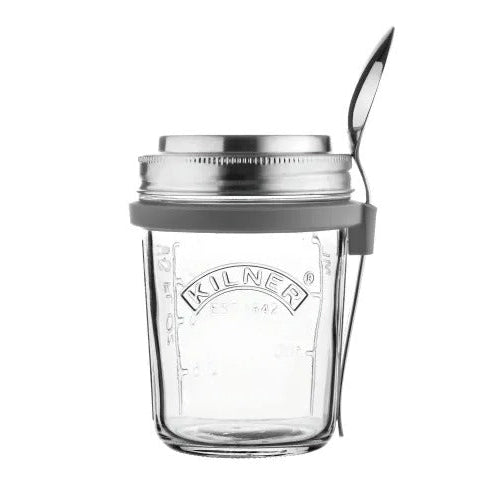 Clear glass jar with metal lid and spoon on a white background, featuring the Kilner brand.