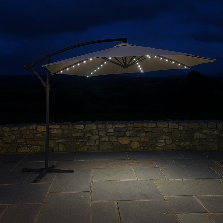 Outdoor umbrella with LED lights on a stone patio at night